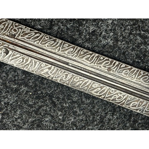 3118 - Sudanese Kaskara Sword with double edged fullered patterned blade 950mm in length. Brass crossguard.... 