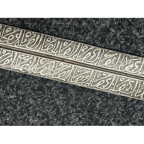 3118 - Sudanese Kaskara Sword with double edged fullered patterned blade 950mm in length. Brass crossguard.... 