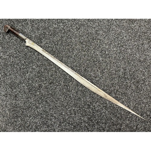 3146 - African sword with single edged blade 650mm in length with decoration to both side with brass inlay.... 