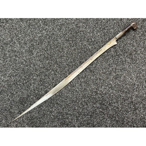 3146 - African sword with single edged blade 650mm in length with decoration to both side with brass inlay.... 