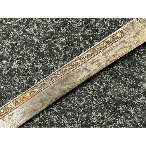 3146 - African sword with single edged blade 650mm in length with decoration to both side with brass inlay.... 