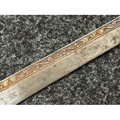 3146 - African sword with single edged blade 650mm in length with decoration to both side with brass inlay.... 