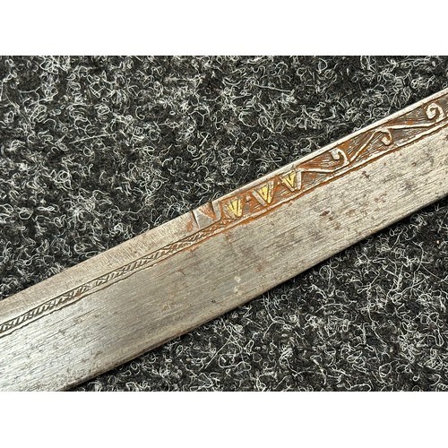 3146 - African sword with single edged blade 650mm in length with decoration to both side with brass inlay.... 