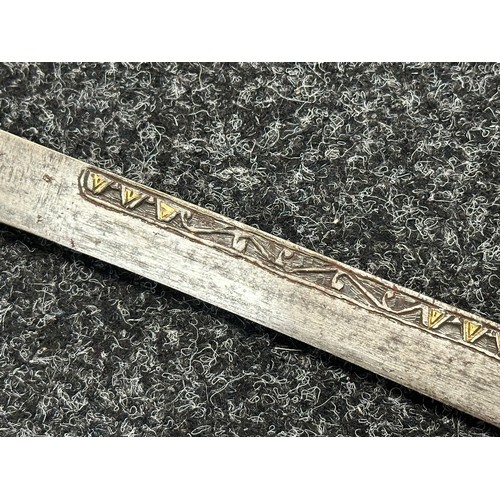 3146 - African sword with single edged blade 650mm in length with decoration to both side with brass inlay.... 