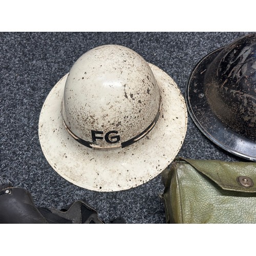 3201 - A collection of WW2 British militaria to include:, Fire Warden steel helmet, Fire Guard steel helmet... 