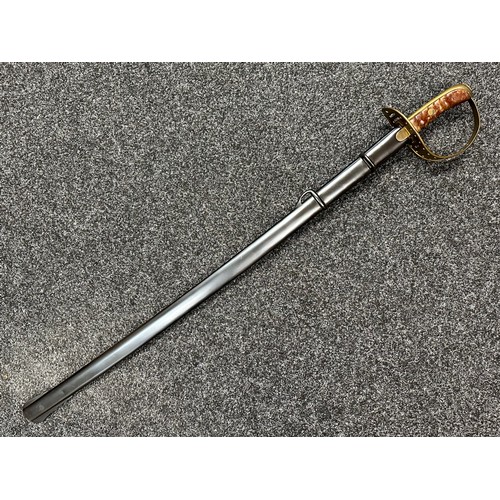 3307 - Sword with single edged fullered blade 907mm in length, marked 