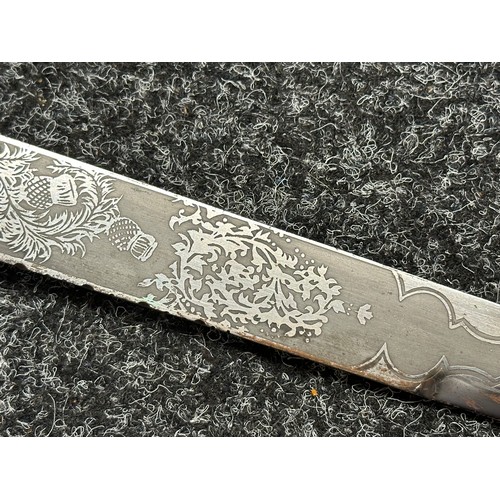 3322 - Scottish Dirk with double edged etched blade decorated with Thistles, 285mm in length. No makers mar... 