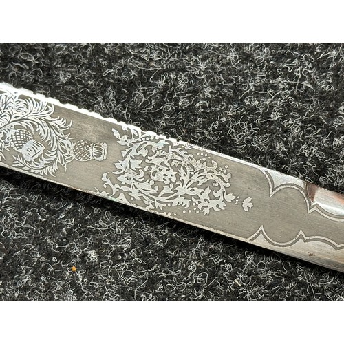 3322 - Scottish Dirk with double edged etched blade decorated with Thistles, 285mm in length. No makers mar... 