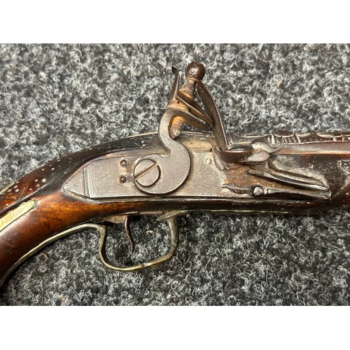 3355 - Flintlock pistol with 220mm long barrel with cast decoration. Bore approx. 17mm. Action not working.... 