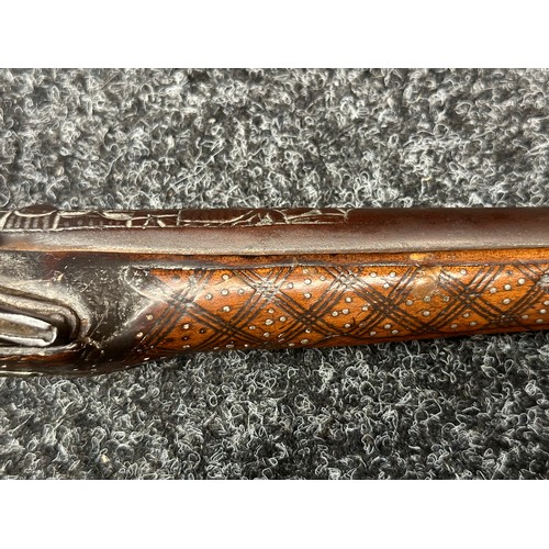 3355 - Flintlock pistol with 220mm long barrel with cast decoration. Bore approx. 17mm. Action not working.... 