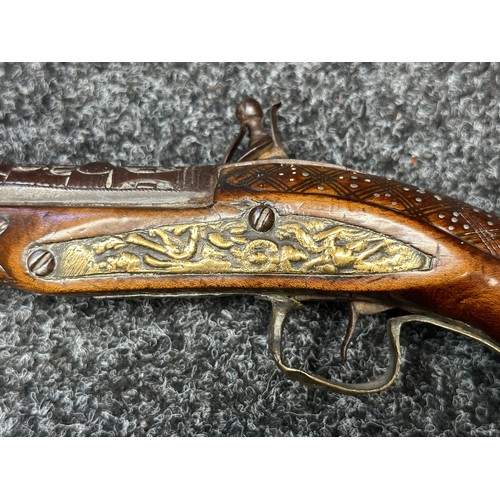 3355 - Flintlock pistol with 220mm long barrel with cast decoration. Bore approx. 17mm. Action not working.... 