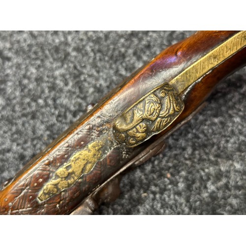 3355 - Flintlock pistol with 220mm long barrel with cast decoration. Bore approx. 17mm. Action not working.... 