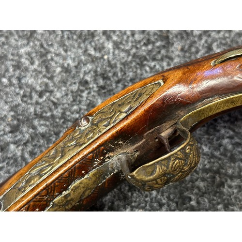 3355 - Flintlock pistol with 220mm long barrel with cast decoration. Bore approx. 17mm. Action not working.... 