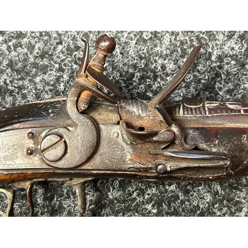 3355 - Flintlock pistol with 220mm long barrel with cast decoration. Bore approx. 17mm. Action not working.... 