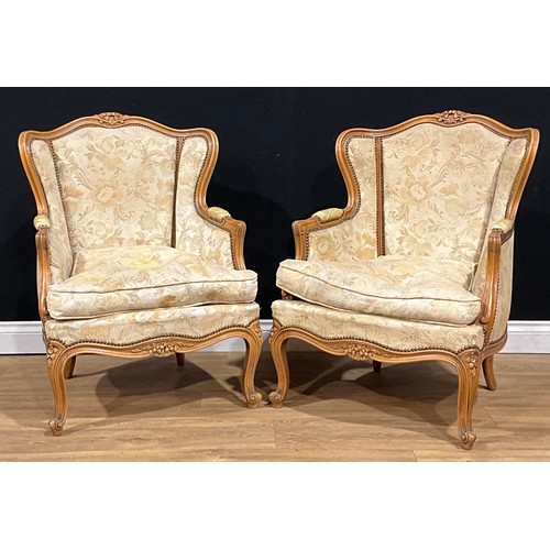 105 - A pair of Louis XV style wing chairs, 90cm high, 64cm wide, the seat 49cm deep

NB - This lot is off... 