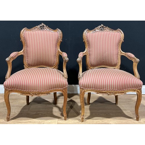 107 - A pair of Louis XV style walnut open armchairs, 94cm high, 61cm wide, the seat 45cm deep (2)