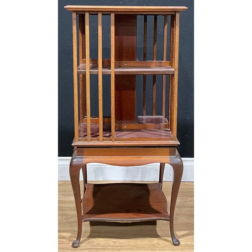 201 - An early 20th century mahogany revolving bookcase, by James Shoolbred and Company, badged, 86cm high... 