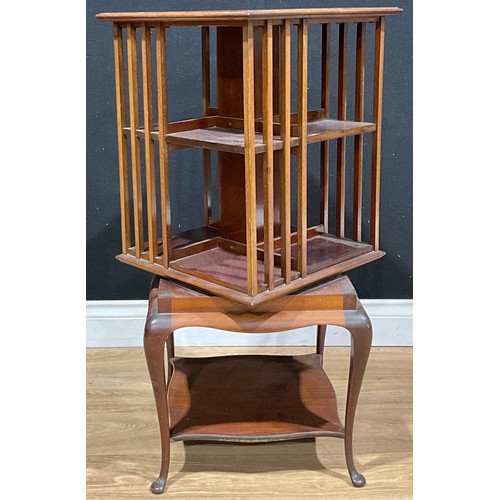 201 - An early 20th century mahogany revolving bookcase, by James Shoolbred and Company, badged, 86cm high... 