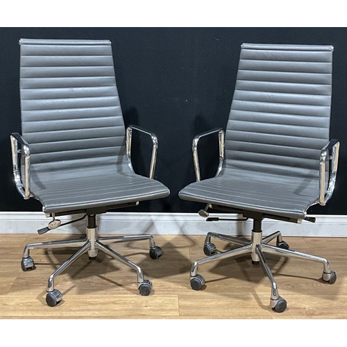 211 - 20th Century Design - a pair of swivel office chairs, after a design by Charles & Ray Eames for Herm... 