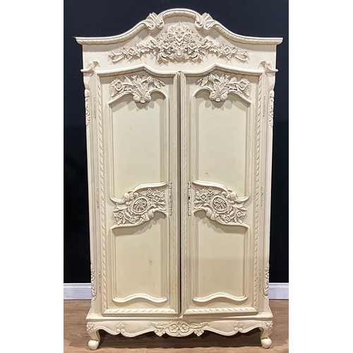 212 - A contemporary French provincial style armoire or wardrobe, 202cm high, 114cm wide, 58cm deep; a sim... 