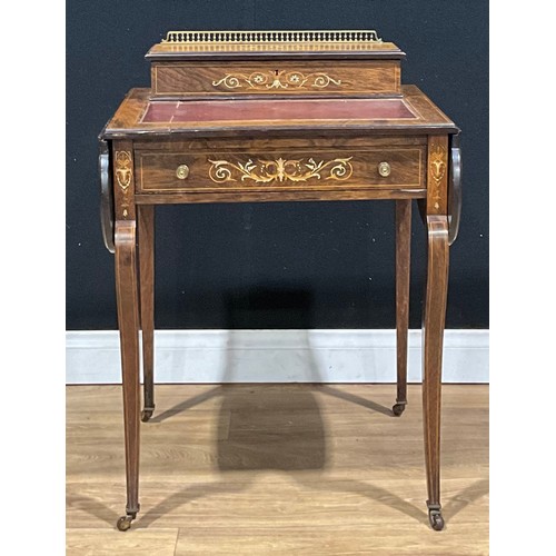 217 - A late Victorian/Edwardian rosewood and ivorine marquetry writing table, 82.5cm high, 58.5cm opening... 