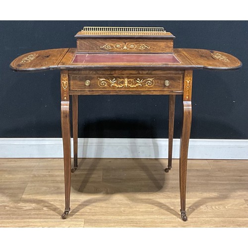217 - A late Victorian/Edwardian rosewood and ivorine marquetry writing table, 82.5cm high, 58.5cm opening... 