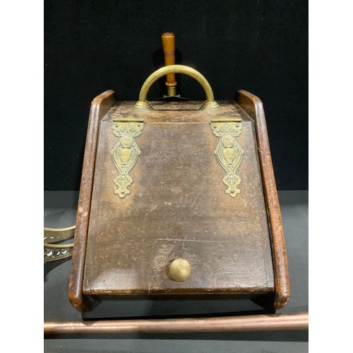 335 - An Arts & Crafts oak fuel bin, brass fittings, 43cm long; a large brass fireside cannon, 43cm long; ... 