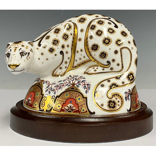 188 - A Royal Crown Derby paperweight, Snow Leopard, gold stopper, 13cm high, printed marks in red, oval w... 