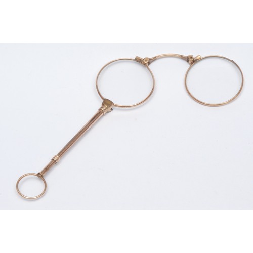 471 - A pair of Victorian brass lorgnette reading spectacles, decorated nose bridge, accompanied by a late... 