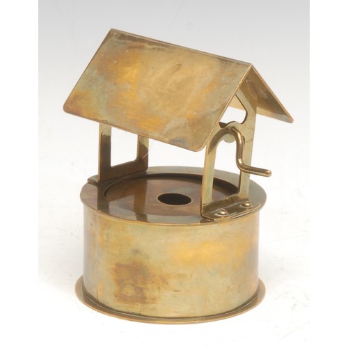 476 - An unusual trench art type musical model, of a well, Swiss movement, no.81418, early 20th century