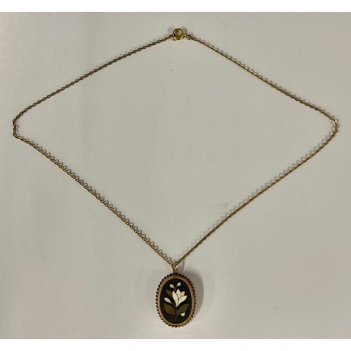 528 - A Victorian Ashford black marble and brass mounted pendant, 2.5cm high overall, suspended on a yello... 