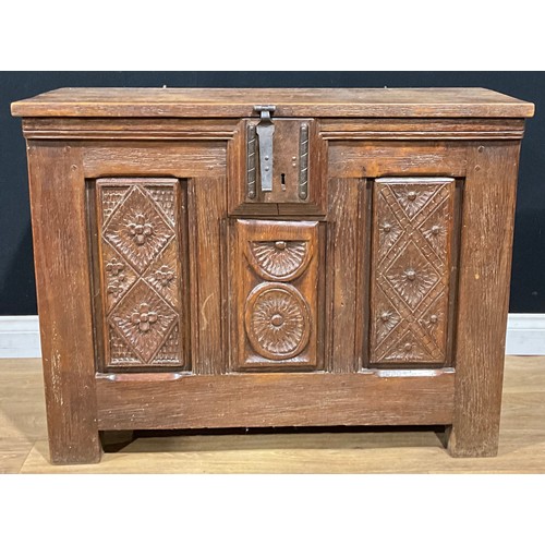 120A - A 17th century style oak blanket chest, hinged top, the panels carved with geometric motifs, 78cm hi... 