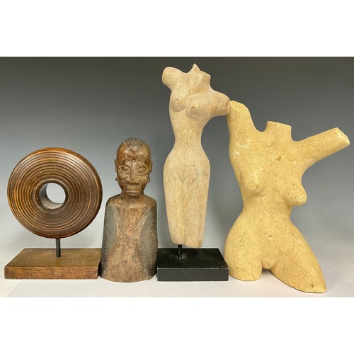 549 - A contemporary composite stone sculpture, of a stylised female torso, 33cm high; a similar carved wo... 