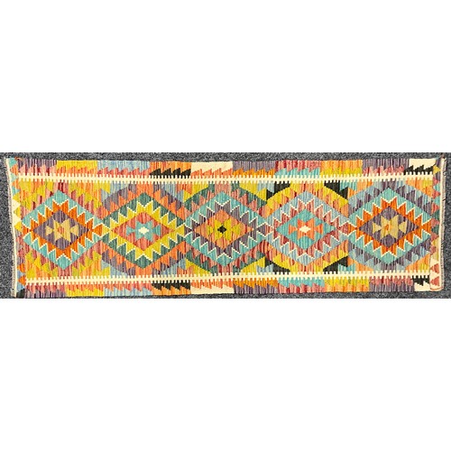 563 - Oriental Rugs and Carpets - a Chobi Kilim runner, 198cm x 62cm