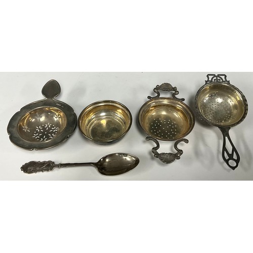 48 - A silver tea strainer and stand, Birmingham 1995; other silver tea strainers; a silver teaspoon, the... 