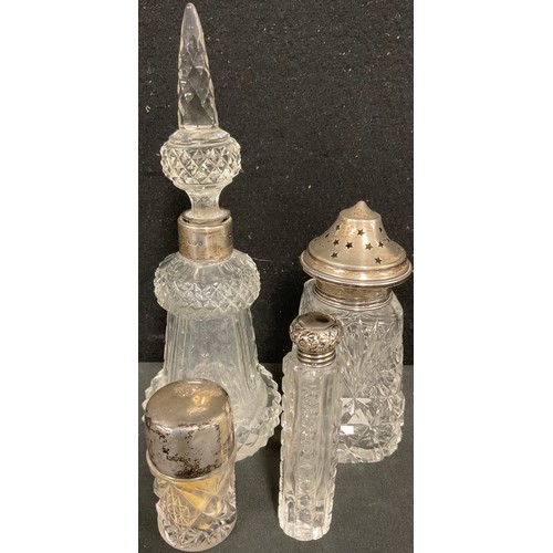 78 - An Edwardian silver mounted cut glass smelling salts bottle, 7cm high, Chester 1905; a late Victoria... 