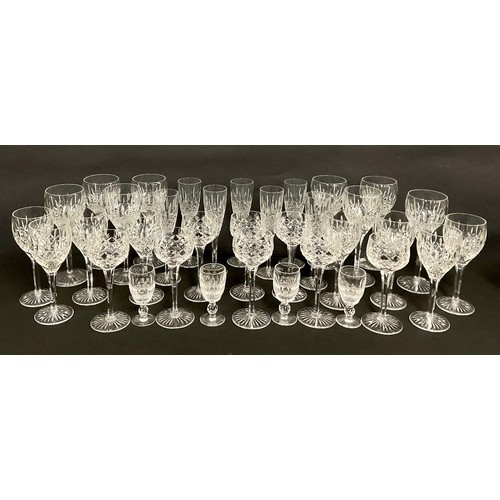 93 - Glassware - Stuart Crystal cut glass part suite of drinking glasses, including champagne flutes, hoc... 