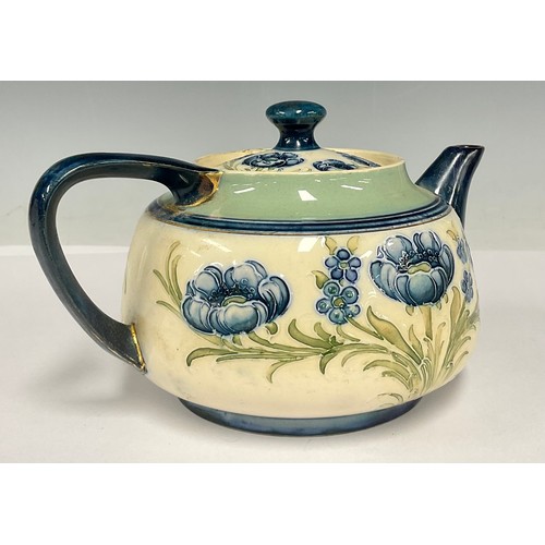 17 - A Moorcroft MacIntyre Florian teapot and cover, tube lined with blue poppies, printed marks, 11.5cm ... 