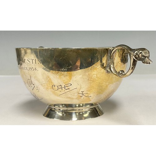 21 - A George V silver presentation loving cup, awarded to Edwin Austin 20th October 1934, scrolling hand... 