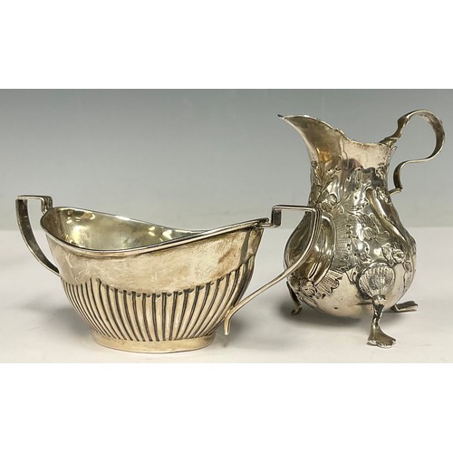 28 - A George V silver half-fluted two-handled sugar basin, Birmingham 1924; a George III silver cream ju... 