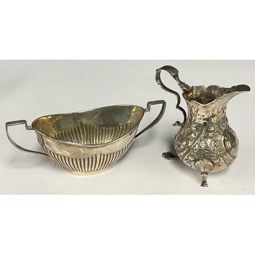 28 - A George V silver half-fluted two-handled sugar basin, Birmingham 1924; a George III silver cream ju... 