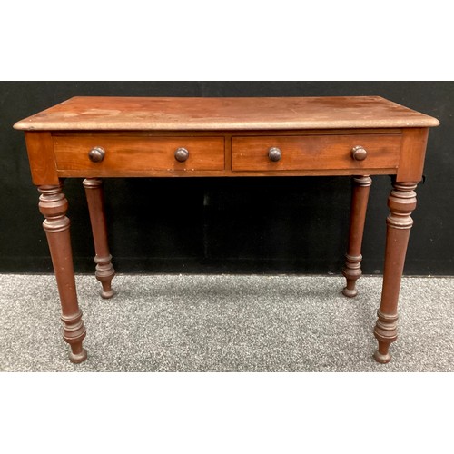 102 - A Victorian mahogany side table, rounded rectangular top, with pair of drawers to frieze, turned leg... 