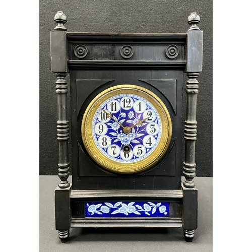 111 - An Arts-and-Crafts/Aesthetic Movement mantel clock, circular blue and white floral enamelled dial, b... 