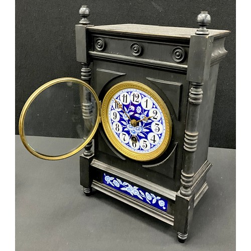 111 - An Arts-and-Crafts/Aesthetic Movement mantel clock, circular blue and white floral enamelled dial, b... 