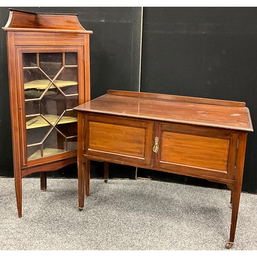 138 - A small Edwardian mahogany corner cabinet, galleried top, above an astral-glazed door enclosing two ... 