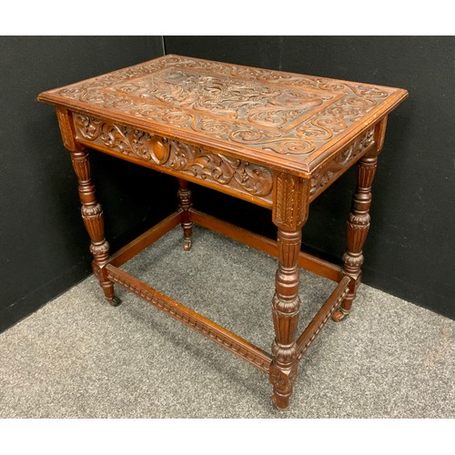 165 - A Victorian Jacobean revival carved oak side table, the top carved in relief with fruit-filled tazza... 