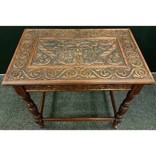 165 - A Victorian Jacobean revival carved oak side table, the top carved in relief with fruit-filled tazza... 