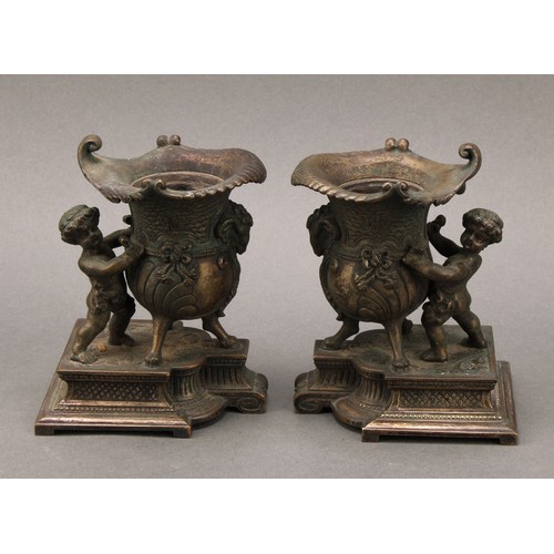 171 - A pair of 19th century bronze mantel vases, each cast in the Louis XV taste as a scantily clad Bacch... 