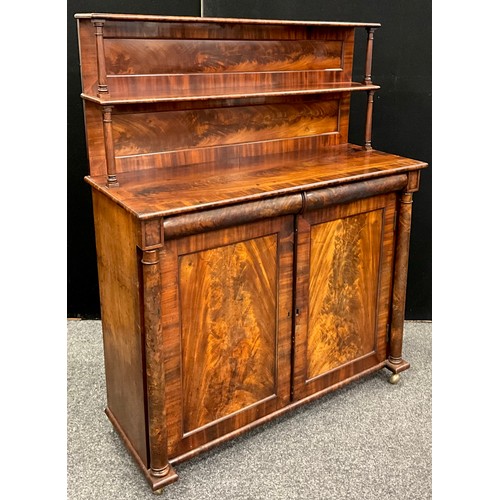 184 - An early Victorian mahogany chiffonier, the superstructure with two shelves, rectangular top above a... 