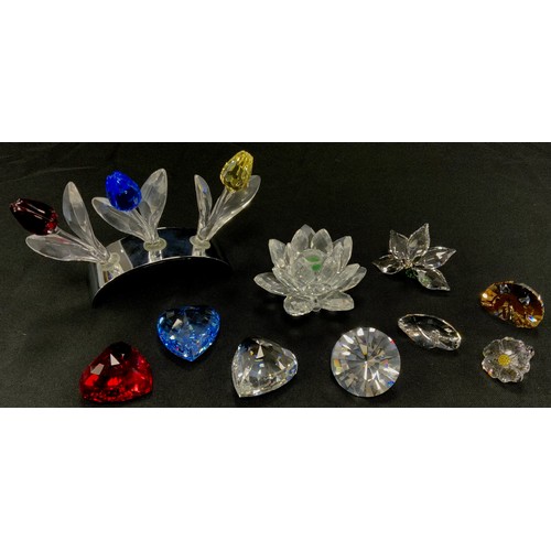 18 - Swarovski Crystal trinkets including; Tulip set, heart set, Lotus candlestick holder; others, all bo... 